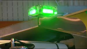 Green light on municipal snow plow to remind motorists to slow down.